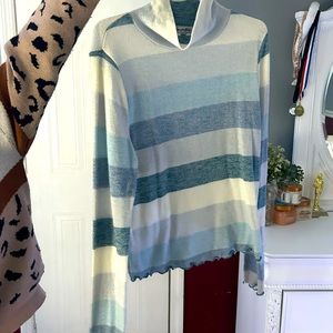 It’s a striped color turtle neck. Great to wear with vests or anything really.